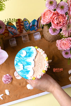 Gateau Gourmet Cafe floral beach cake dessert with ocean wave design and summer theme