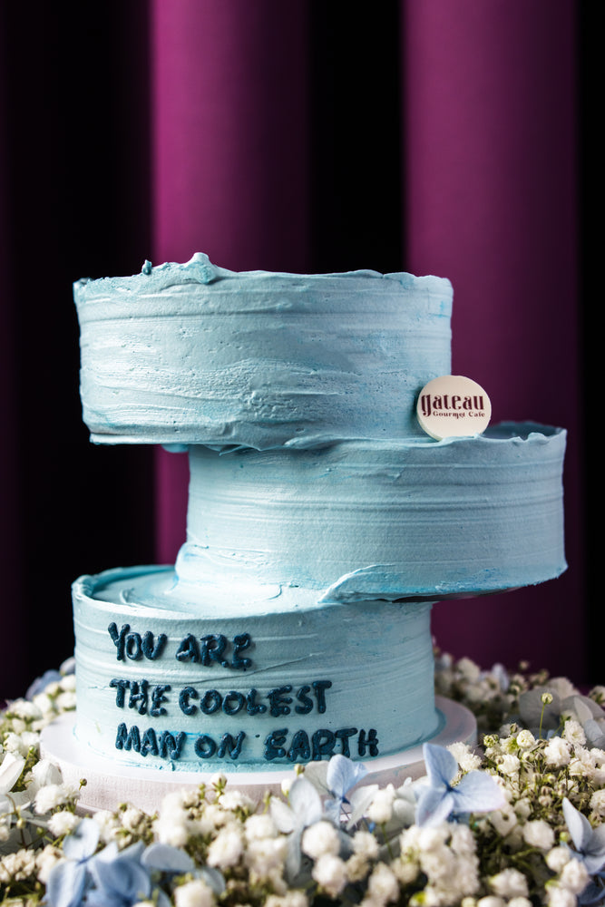 Father's Day floral arrangement cake with blue frosting and message from Gateau Gourmet Cafe