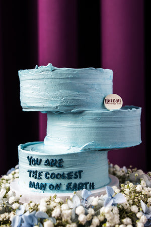 Father's Day floral arrangement cake with blue frosting and message from Gateau Gourmet Cafe