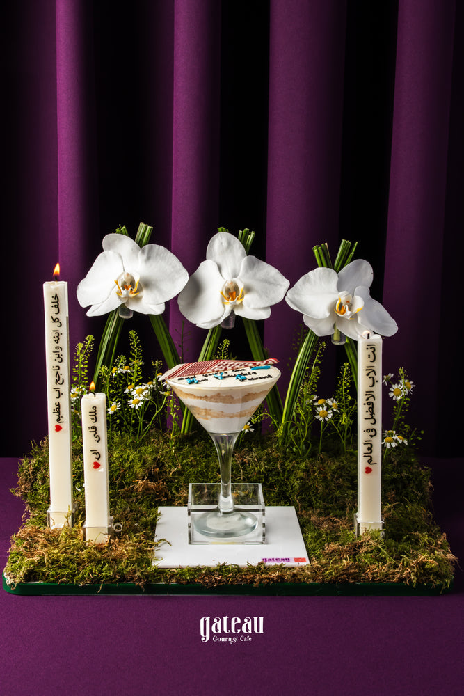 Father's Day dessert goblet by Gateau Gourmet Cafe with layered cake served in a clear goblet surrounded by white orchids and candles