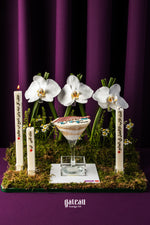Father's Day dessert goblet by Gateau Gourmet Cafe with layered cake served in a clear goblet surrounded by white orchids and candles