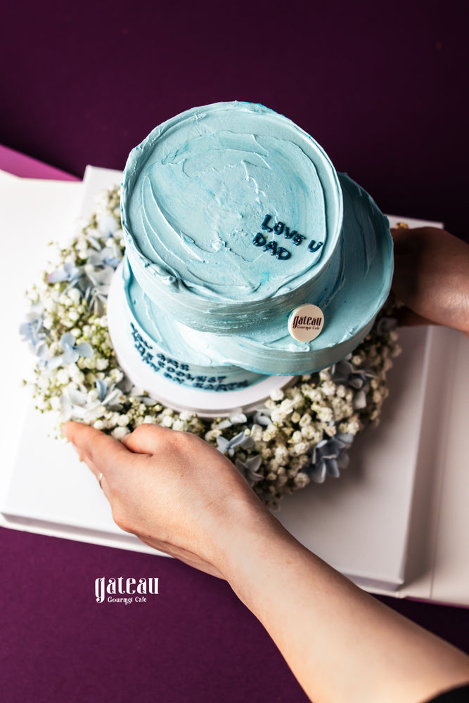 Father's Day floral arrangement cake by Gateau Gourmet Cafe with light blue frosting and love message