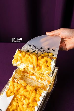 Gateau Gourmet Cafe mango cake with whipped cream being served for Father's Day cake delivery