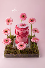 All Pink Victorian Cake with Mirror and Flower Arrangement on a decorative base with pink flowers