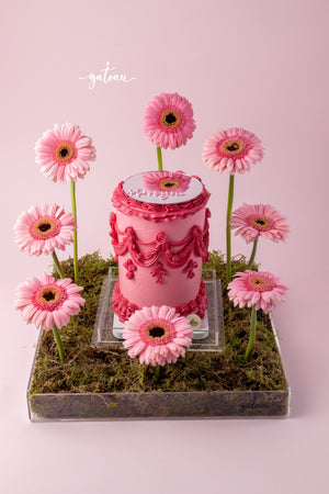 All Pink Victorian Cake with Mirror and Flower Arrangement on a decorative base with pink flowers