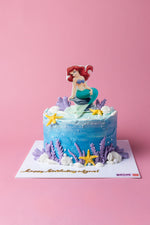Ariel mermaid birthday cake by Gateau Gourmet Cafe with ocean-themed decorations and edible starfish
