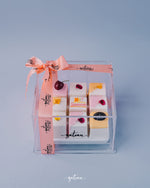 Gateau Gourmet Cafe artisan mini cakes delivery set in clear box with pink ribbon and decorative toppings