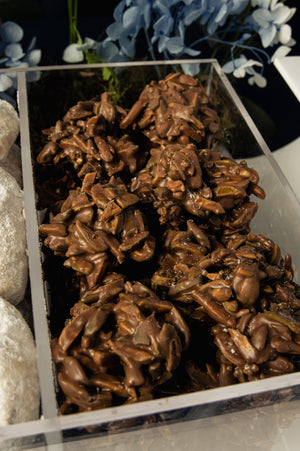 Delicious assorted Arabic treats with arrangement in a clear display at Gateau Gourmet Cafe