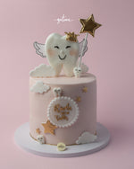 Baby tooth celebration cake featuring a cute tooth design with wings and a golden star on top