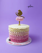 Ballerina themed cake with pink ruffles and a dancer topper, perfect for celebrations