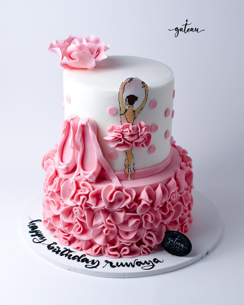 Elegant ballet birthday cake with pink ruffles and ballerina design for a festive celebration