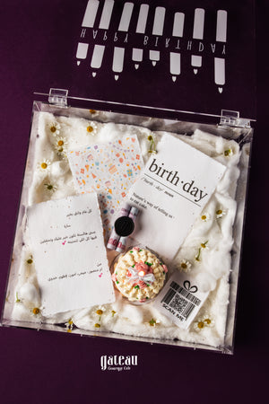 Elegant birthday gift box online from Gateau Gourmet Cafe with cake, notes, and decorative elements