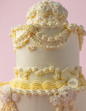Bride to Be custom cake by Gateau Gourmet Cafe with elegant white floral and ruffle frosting decoration