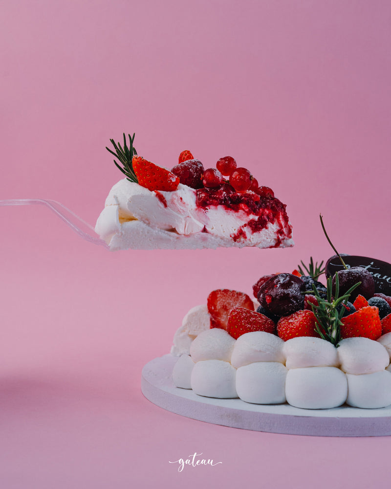 Slice of Gateau Gourmet Cafe bavlova with fresh strawberries and berries to buy bavlova online