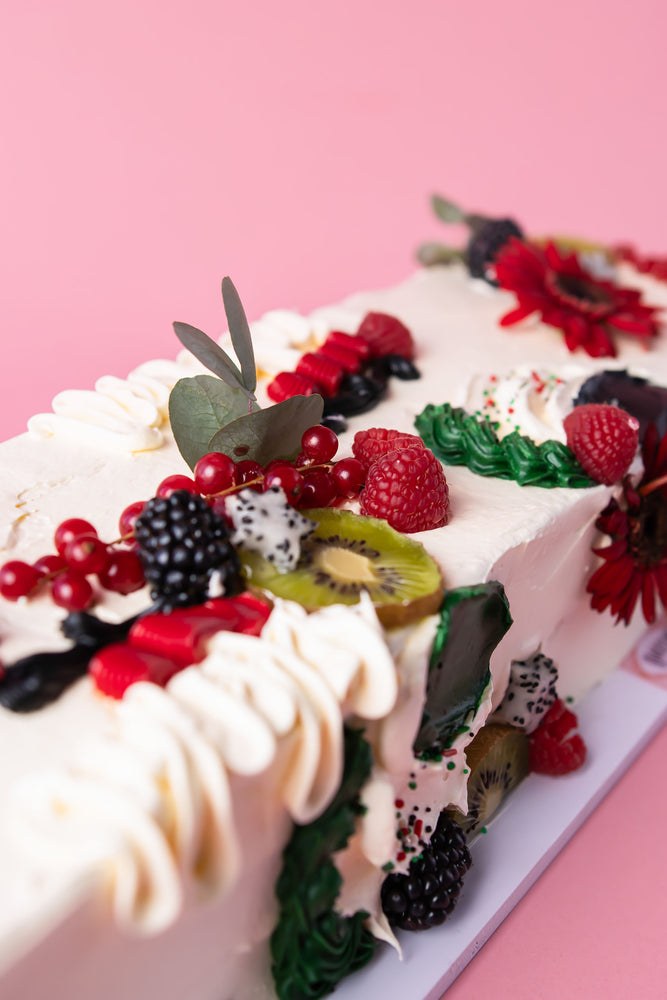 Delicious fruity cake with fresh berries and decorations, perfect to buy fruity cakes for celebrations