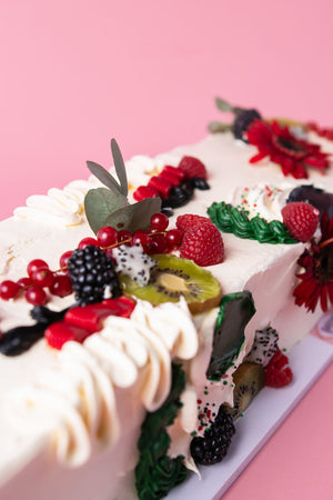 Delicious fruity cake with fresh berries and decorations, perfect to buy fruity cakes for celebrations