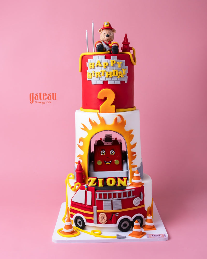 3Tier Fire House Theme Fondant Cake with firefighter toppers and vibrant details for birthday celebrations