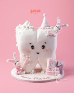 Baby’s First Tooth Celebration Cake featuring a tooth design with cute bunnies and pastel accents