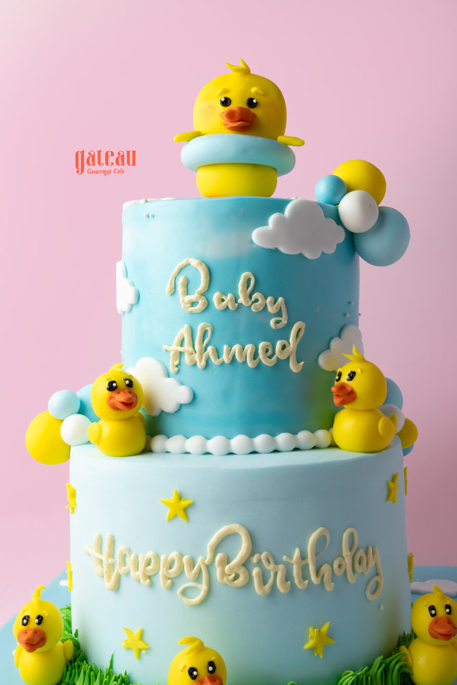 Duck themed birthday cake from Gateau Gourmet Cafe with playful yellow duck decorations and blue icing