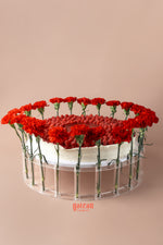 Gateau Gourmet Cafe overloaded raspberry cake decorated with fresh red flowers for an elegant presentation
