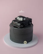 Unique birthday cakes for him featuring a chocolate truck design on a gray buttercream cake