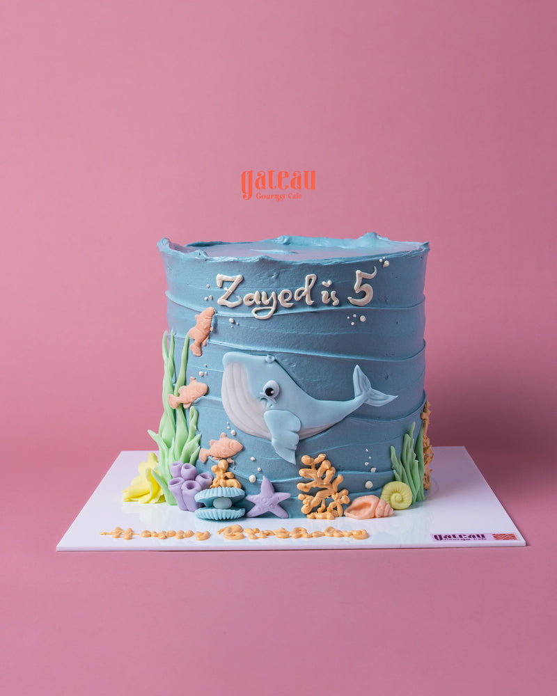 Ocean whale theme cake celebrating Zayed's 5th birthday with vibrant sea decorations