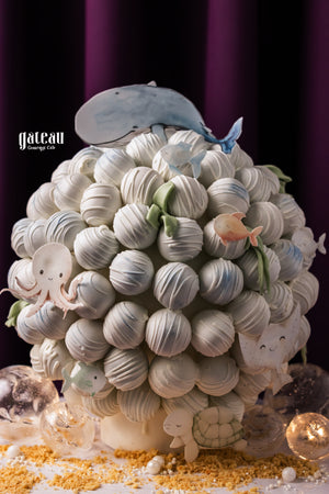 Gateau Gourmet Cafe whale truffle tower decorated with cute ocean-themed designs and colorful sea creatures