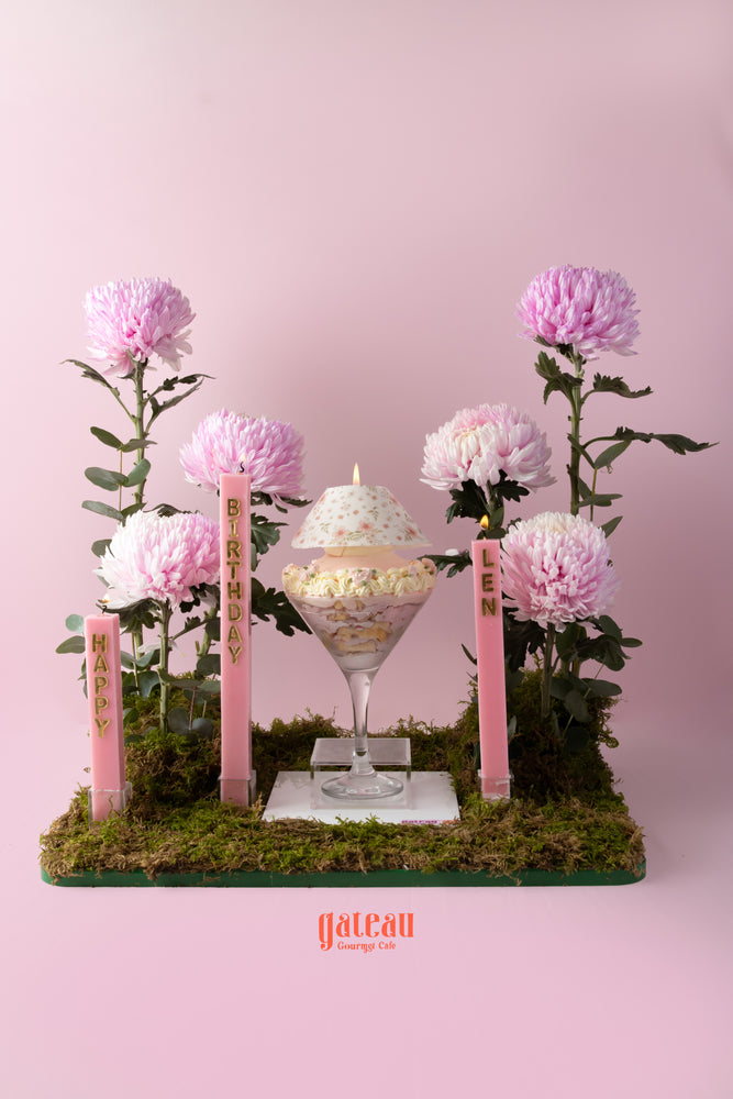 Delicious cake with flower arrangement for a birthday celebration from Gateau Gourmet Cafe