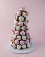 Gateau Gourmet Cafe pink and white choux tower dessert decorated with edible butterflies and flowers