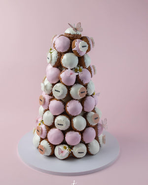 Gateau Gourmet Cafe pink and white choux tower dessert decorated with edible butterflies and flowers