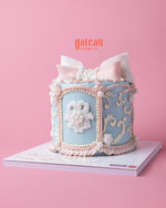 Circus dream carousel cake with elegant pastel blue design and intricate floral decorations from Gateau Gourmet Cafe