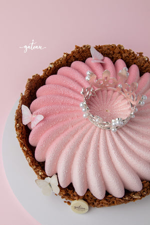 Elegant Crunchy Pink Mousse Cake with a delicate crown and decorative butterflies
