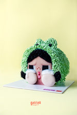 CRYBABY character birthday cake by Gateau Gourmet Cafe with detailed green hair and crying face design