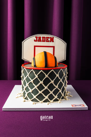 Gateau Gourmet custom basketball birthday cake with basketball and net design topped with personalized name Jaden