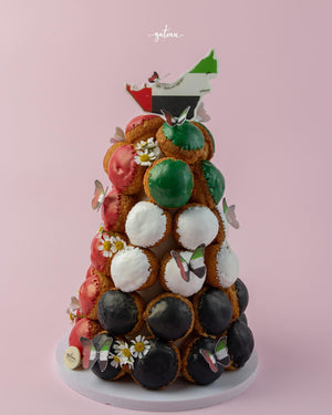 Gateau Gourmet Cafe custom choux pastries tower with green white black and pink cream puffs decorated with butterflies