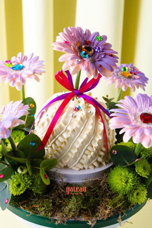 Custom floral cake for summer with pink flower decorations and colorful gems by Gateau Gourmet Cafe