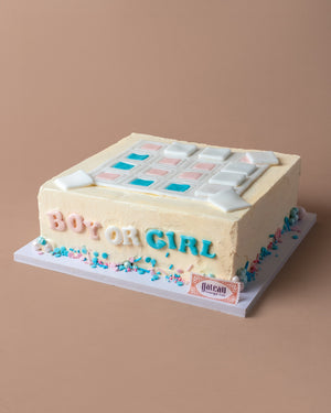 Custom gender reveal cakes from Gateau Gourmet Cafe with pink and blue decorations