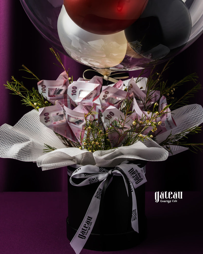 Custom graduation balloon bouquet with decorative elements and cash gifts for celebratory occasions