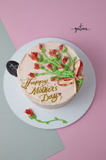 Gateau Gourmet Cafe custom Mother's Day cakes with pink icing and red flower decorations