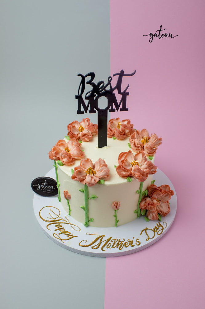 Gateau Gourmet Cafe custom Mother's Day cakes with pink flower decorations and Best Mom topper