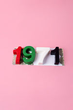 Custom number mousse cake featuring the numbers 1, 9, 7, and 1 in bright colors for celebrations