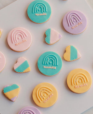 Gateau Gourmet Cafe custom sugar cookies in pastel colors with rainbow and heart designs