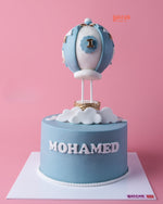 Customized air balloon themed cake by Gateau Gourmet Cafe with a blue design and gold accents