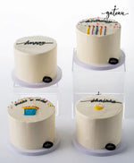 Set of four customized birthday cakes from Gateau Gourmet Cafe with festive decorations and colorful candles