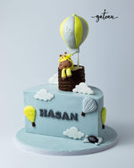 Customized half cake by Gateau Gourmet Cafe with blue sky design and hot air balloon topper