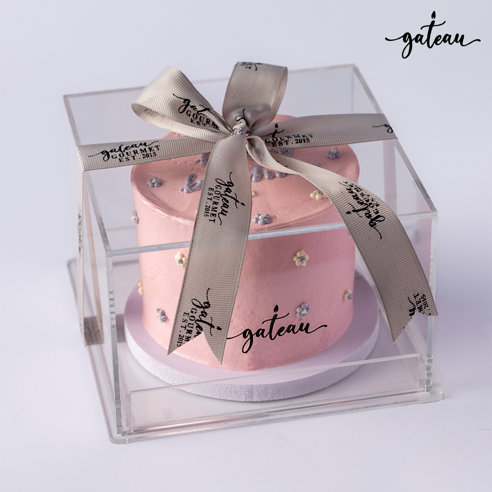 Pink birthday cake for girls from Gateau Gourmet Cafe in clear gift box with decorative bow