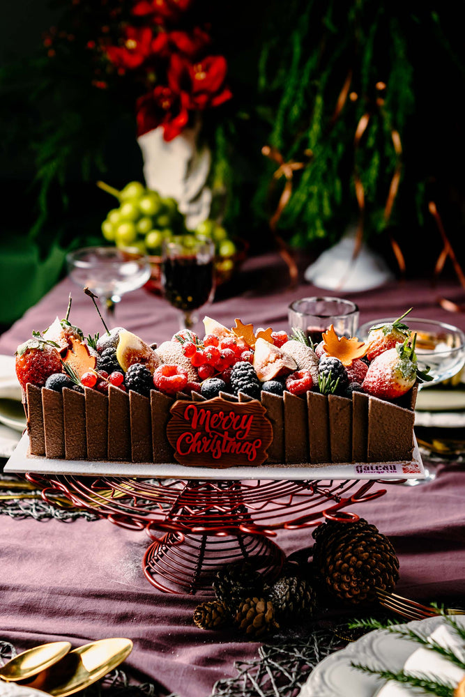 Gateau Gourmet Cafe fruit brownies dessert topped with festive fruits and holiday decorations