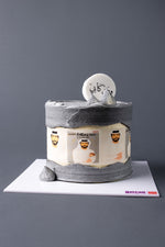 Father's Day custom cake from Gateau Gourmet Cafe with gray and white frosting and male face decorations