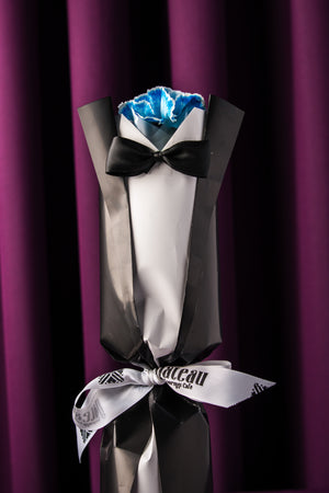 Father's Day flower by Gateau Gourmet Cafe wrapped in black and white paper with a black bow