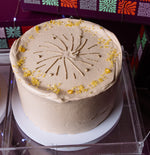 Fireworks celebration cake with decorative icing and yellow sprinkles for festive occasions